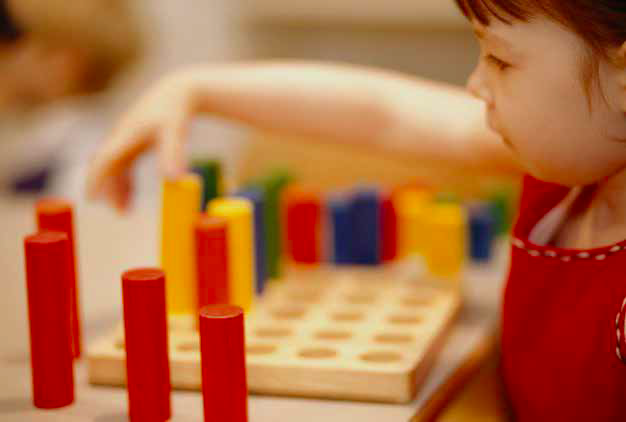 Baby solving a puzzle